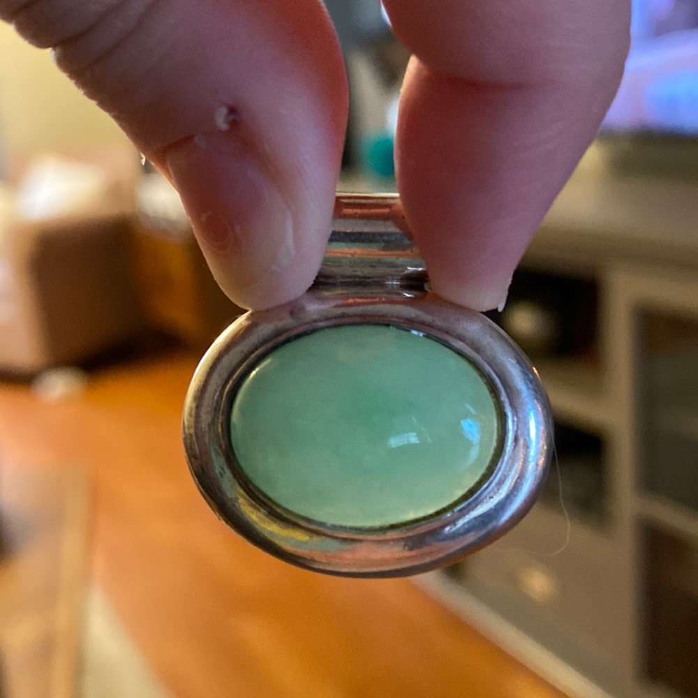 Sterling silver and jade pendant.